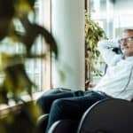 old man sitting in massage chair