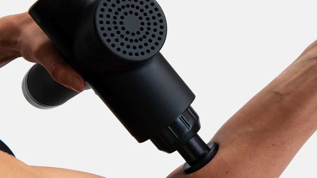 forearm massage with a heated massage gun