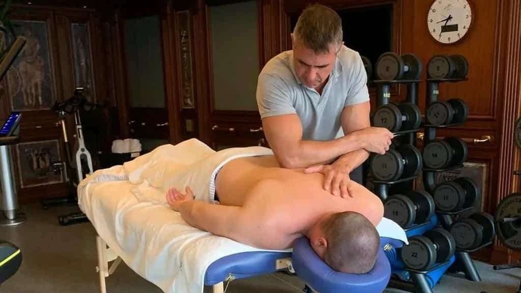 a man gives a deep back massage