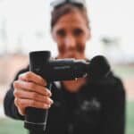 Woman holding Hypervolt Go