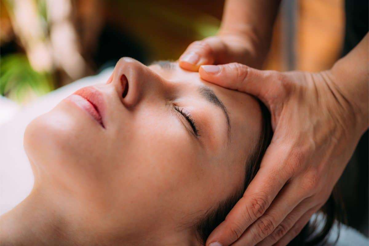 Woman at a head massage session