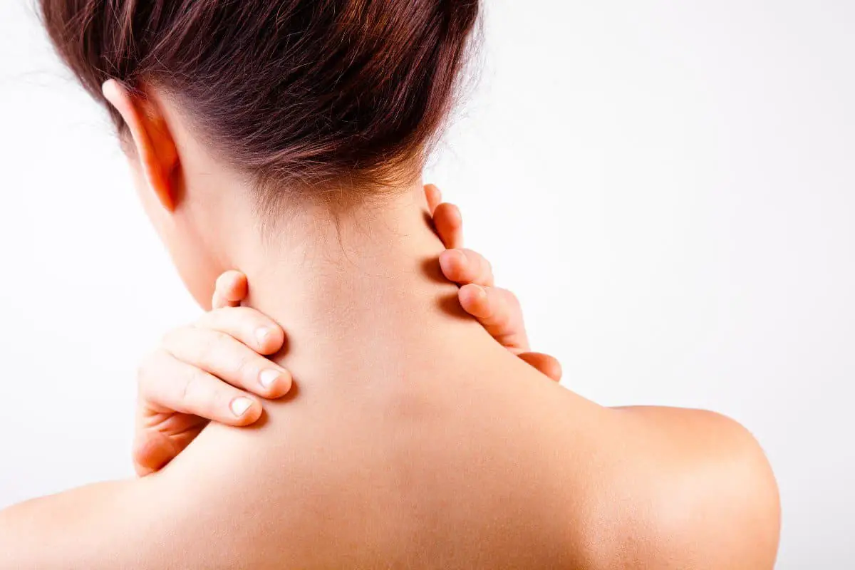 Woman with neck pain after a massage