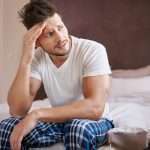 Man thinking abut the erection he got during a massage earlier