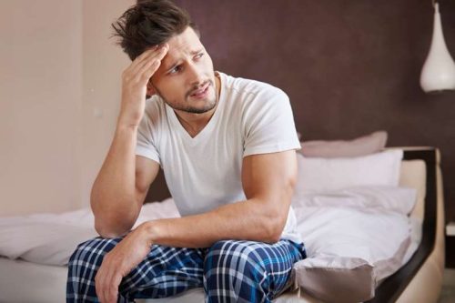 Man thinking abut the erection he got during a massage earlier