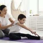 Child receiving a calming massage from their parent
