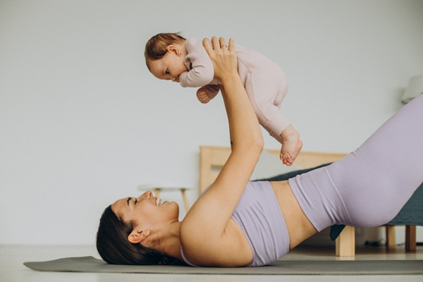 postpartum massage helping relieve back pain after childbirth