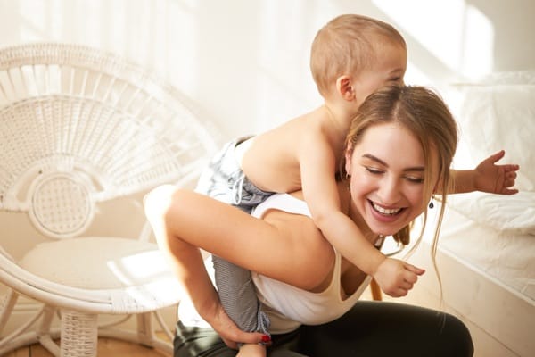 mother and baby enjoying quality time together smiling and laughing