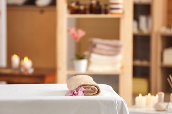 Calm wellness setting with massage table and soft lighting