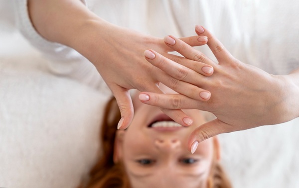How to Give Yourself a Hand Massage 6144 (4) Woman relaxing after giving herself a hand massage