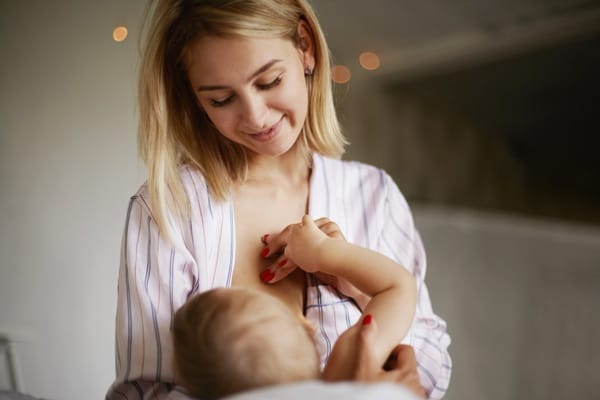 Other Natural Ways to Increase Milk Supply, woman contently breastfeeding her baby