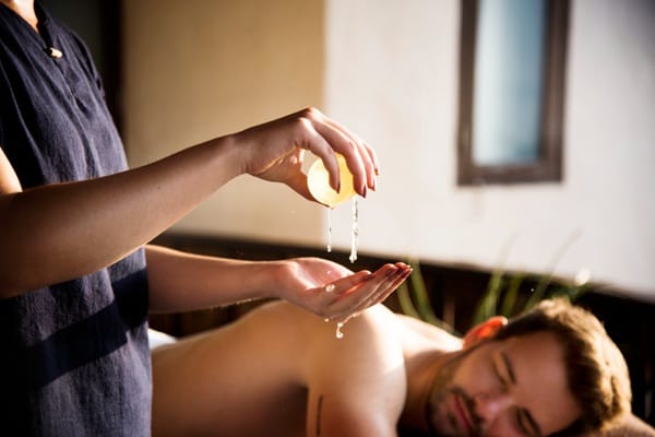Applying diluted essential oils for massage using gentle hand movements