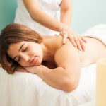 woman receiving gentle back massage in calm spa setting relaxation and wellness therapy