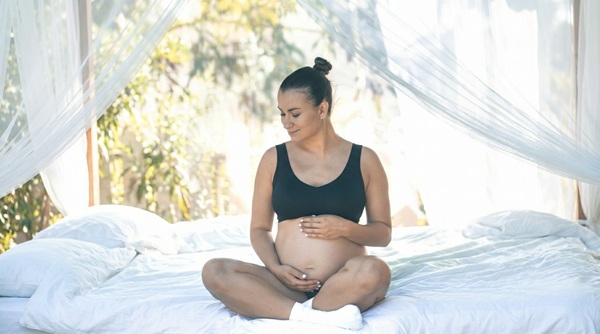 pregnant woman relaxing at home before safe pregnancy massage